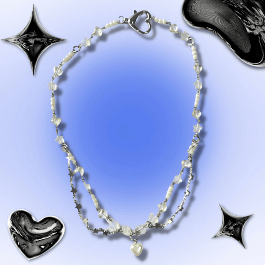 This 20.5 inch necklace is beaded with hearts, stars, and pearls. The front is embellished with star shaped chains. The pendant is a pearl bubble heart. This necklace has a heart shaped clasp.